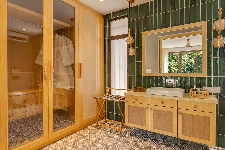 Casa Keval, twin basins beneath a framed mirror