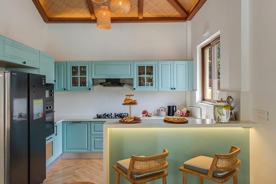 Casa Keval, open kitchen in teal cabinetry