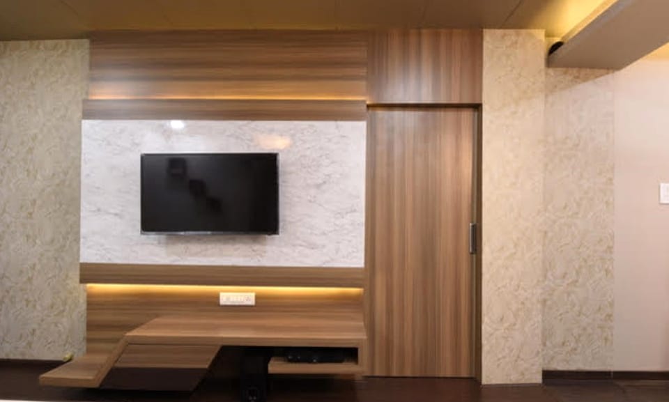 Highland Beach Resort, media wall in stone and backlit timber