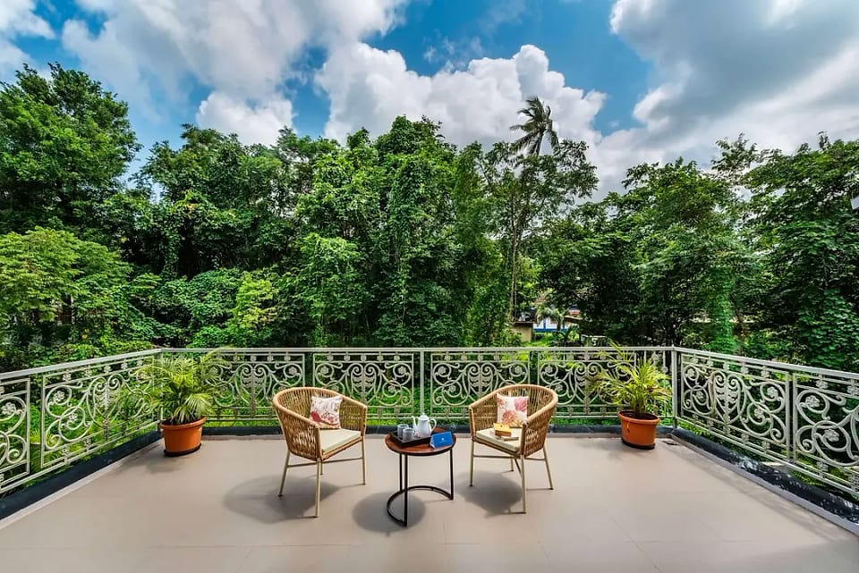 Nerul residence, terrace with wrought-iron railings and treetop views