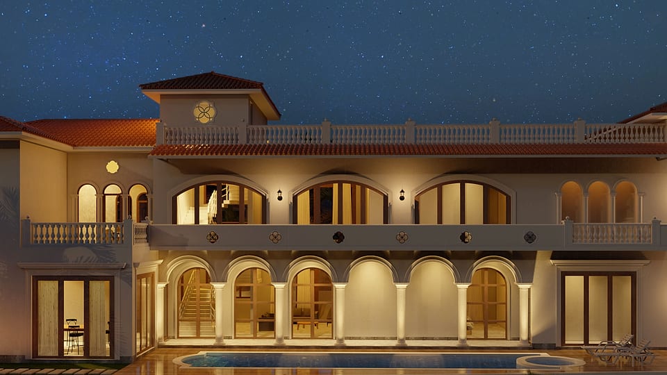 Beera Homes Sangolda, rear elevation lit at night above the pool